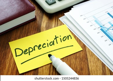 Depreciation Concept. Stack Of Business Papers.