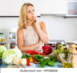 Depressed adult housewife thinking what to prepare for dinner