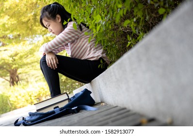 Depressed Asian Child Girl Disappointed With Her Exam At Primary School,female Student Sitting Alone,sad Schoolgirl Feel Stressed,anxious,teenager Was Afraid The Parents Would Rebuke Her, Lifestyle 