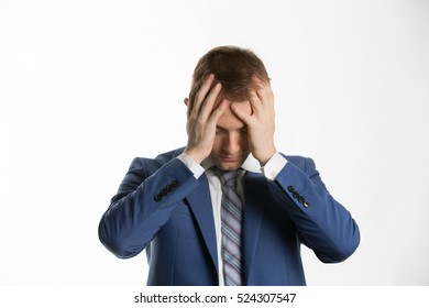 Depressed Businessman With Holding His Head In Hands