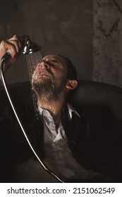 Depressed Crazy Man Mental Health In Bathtub In Bathroom At Home. Problem Person Showing Human Emotions. Concept Apathy, Anxiety, Illness, Trouble, Creative Decline. Copy Space