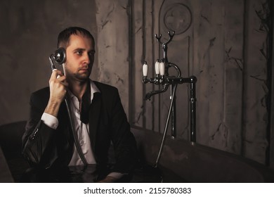 Depressed Crazy Man Mental Health In Bathtub In Bathroom At Home Calling Phone. Problem Person Showing Human Emotions. Concept Apathy, Anxiety, Illness, Trouble, Creative Decline