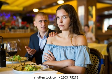 Depressed Family Couple Man And Woman Sitting At Restaurant Unhappy After Quarrel