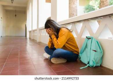 Depressed Female Student Crying And Feeling Sad About Failing Classes At The University 