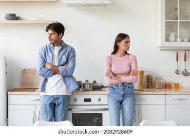 Depressed frustrated millennial european woman ignores her upset husband after quarrel in kitchen interior, copy space. Pause in scandal, stress, crisis and conflict at home during COVID-19 lockdown - Powered by Shutterstock