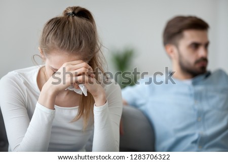 Depressed frustrated millennial woman feeling offended and sad after fight with stubborn selfish husband, unhappy young wife tired of bad relationships, worried about marriage problems concept