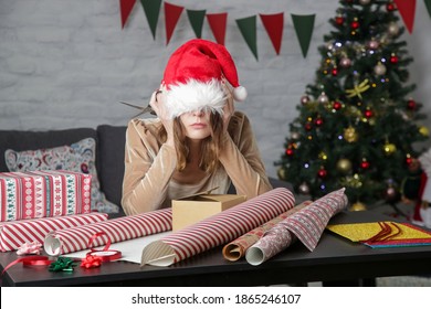 Depressed Frustrated Woman Wrapping Christmas Gift Boxes, Winter Holiday Stress Concept	