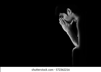 depressed and hopeless man alone in the dark  in white tone