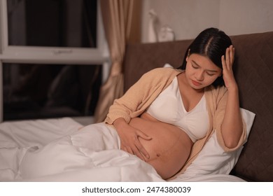 Depressed lonely Asian pregnant devorce woman in bedroom at home. Having a baby. Family people lifestyle. Mom. - Powered by Shutterstock