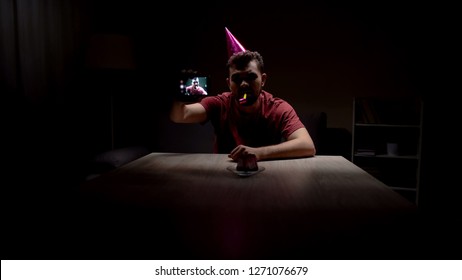 Depressed Man Celebrating Birthday Alone, Making Selfie In Dark Room, Miserable