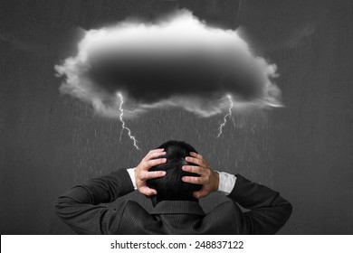 Depressed Man With Dark Cloud Rain Lightning Over His Head, Concrete Wall Background