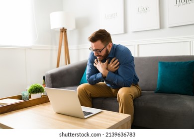 Depressed Man In His 30s Crying And Suffering From Grief. Stressed Man Having Virtual Therapy With A Psychologist 