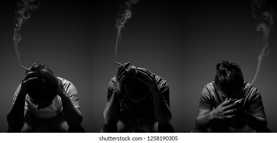 Depressed Man Smoking Cigarette Sitting On Chair On Black Background