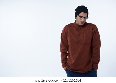 Depressed Man Standing Against White Background