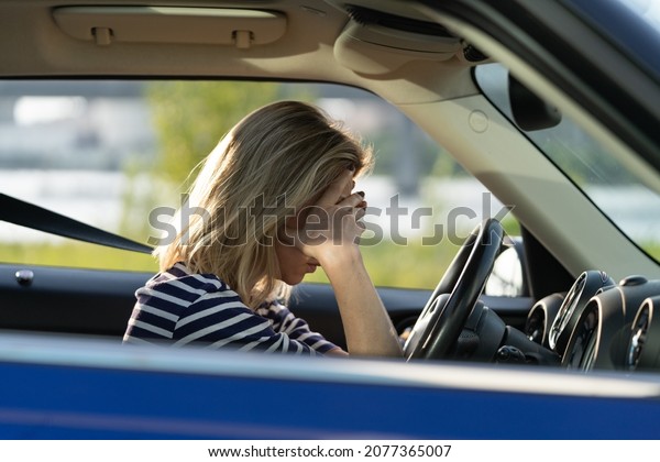 Depressed middle woman driver sitting inside car\
feeling doubtful confused about difficult decision suffering from\
personal psychological problem, burnout, quarrel break up with\
boyfriend, life\
crisis
