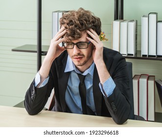 Depressed Office Worker Business Manger With Frustrated Expression On Office Desk Feeling Despair About Business Problem.