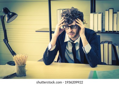 Depressed Office Worker Business Manger With Frustrated Expression On Office Desk Feeling Despair About Business Problem.