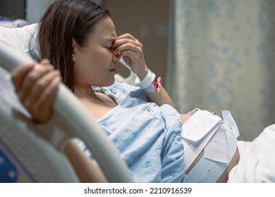 A depressed pregnant woman worried about her baby, in the hospital clinic. - Powered by Shutterstock