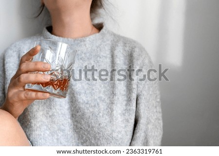 Depressed sad addicted woman feeling bad drinking whiskey alone , stressed frustrated lonely female drinker alcoholic suffer from alcohol addiction having problem, alcoholism concept.