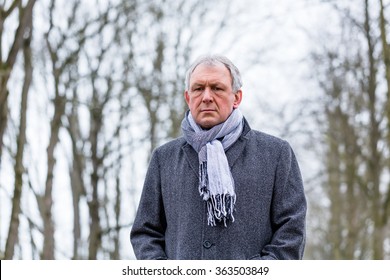 Depressed Or Sad Man Walking In Winter