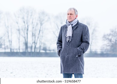 Depressed Or Sad Man Walking In Winter