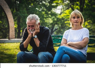 Depressed And Sad Old Senior Couple Sitting On Bench In The Park Background, Making Decision Of Breaking Up Get Divorced, Upset Couple After Fight Dispute