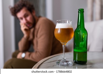 Depressed Sad Young Addicted Man Feeling Bad Drinking Beer Alone At Home, Stressed Frustrated Lonely Drinker Alcoholic Suffer From Alcohol Addiction Having Problem, Alcoholism Concept