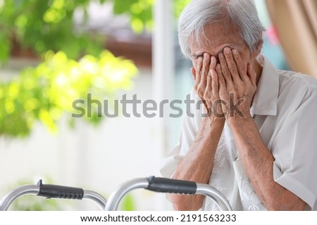 Depressed senior woman covering face with hands,Lonely old people crying alone at home,loneliness,hopelessness,dejection,Sad elderly patient with depression,mental health problems,depressive illness