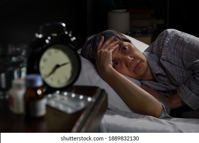 Depressed Senior Woman Lying In Bed Cannot Sleep From Insomnia