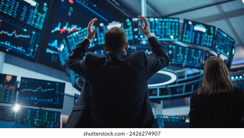 Depressed Stock Exchange Trader Stressed and Angry with Situation on Financial Market. Professional Broker Saddened by Bad News, Holding His Head in Defeated Fashion, Showing Negative Emotions - Powered by Shutterstock