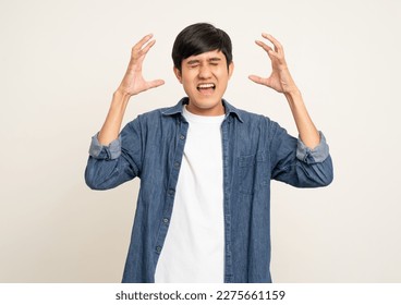 Depressed stressed. Young asian man hand touching headache on isolated white background. Angry middle aged Indian man has symptom office syndrome. - Powered by Shutterstock