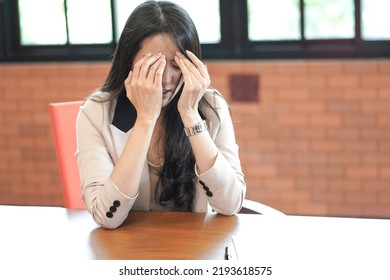 Depressed And Stressed Young Asian Woman Meet Financial Problem After Unemployed From Company Financial Crisis Effect And Recession Economy And Headache Stress Pressure From Work Place