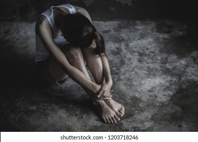 The Depressed Teen Sat On The Floor, Stressed Sad Young Woman Having Mental Problems,Domestic Violence And Trafficking