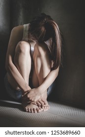 The Depressed Teen Sat On The Floor, Stressed Sad Young Woman Having Mental Problems,Domestic Violence And Trafficking