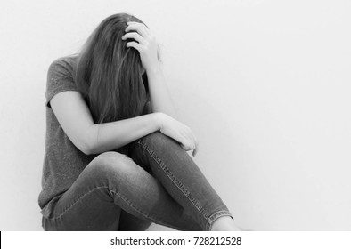 Depressed teenager sitting holding head in hands, stressed sad young woman having mental problems, feeling bad, need psychological help, addicted heartbroken girl experiencing adolescence crisis