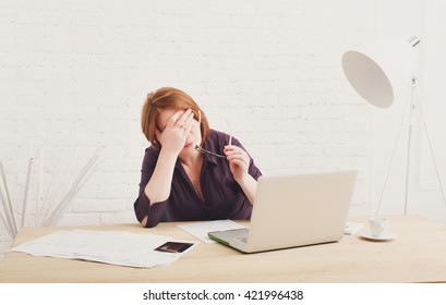 Depressed And Upset Businesswoman In Her Office. Middle Aged Woman Sad, Frustrated 