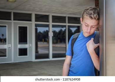 Depressed Upset Student Standing Outside School Doors