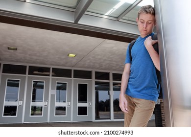 Depressed Upset Student Standing Outside School Doors