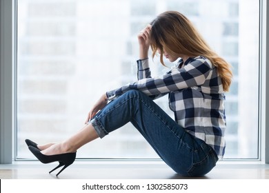 Depressed Vulnerable Young Woman In Trouble Sitting On Floor Alone Feeling Lost Upset And Lonely, Sad Female Victim Feeling Bad Hurt Or Tired Having Drama Or Psychological Problems, Regrets Mistake