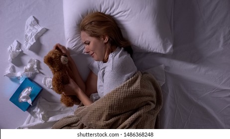 Depressed Woman In Bed Crying, Hugging Toy Bear, Suffering From Miscarriage