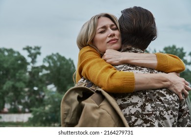 Depressed Woman Hugging Her Husband Before Leaving On War