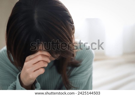 A depressed woman looking down