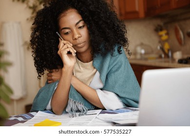 Depressed Young African Woman Not Able To Pay For Gas And Electricity Bills Talking On Mobile Phone, Unhappy With Bank Decision Not To Prolong Loan Term. Financial Problem And Economic Crisis