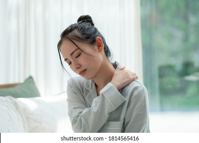 Depressed young asian woman in bedroom. - Shutterstock ID 1814565416