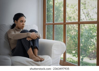 Depressed young Black woman with mental health problem in mind need crucial treatment from overthinking fatigue girl, disruptive thought, dissocial, anxiety and other mental health disorders .