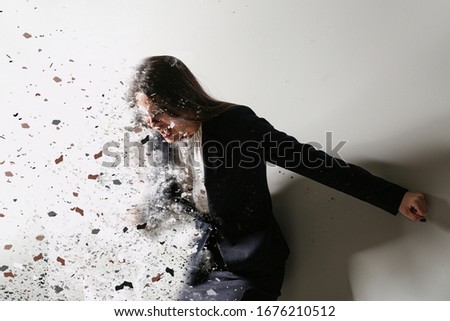 Depressed young businesswoman on light background