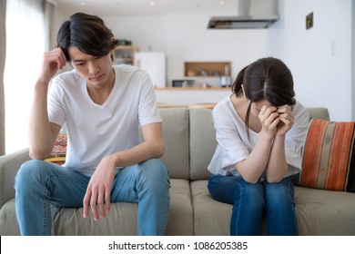 Depressed young couple in the house.