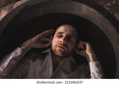 Depressed Young Man Mental Health In Bathtub In Bathroom At Home. Person Showing Human Emotions. Concept Apathy, Anxiety, Illness, Trouble, Creative Decline, Or Bankruptcy