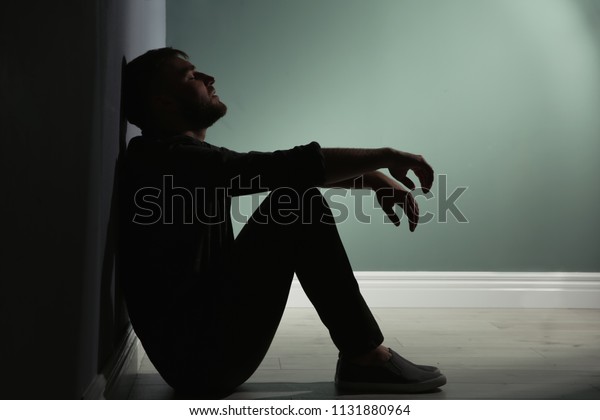 Depressed Young Man Sitting On Floor Stock Photo (Edit Now) 1131880964