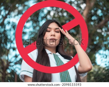 A depressed young woman after being called out, blocked, or shunned in social media or in person. Cancel culture concept. With stop sign graphic. Stock photo © 